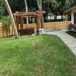 One-of-a-kind Natural Wood Pergola and Paver Patio and Walkway