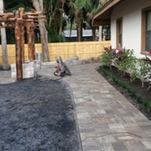 Side yard with new walkway, custom pergola and paver patio
