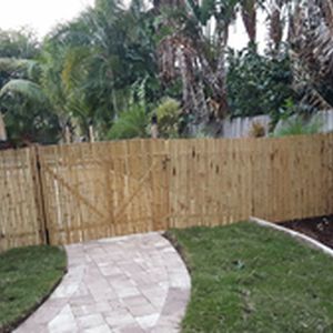Bamboo fence and gate outside completed