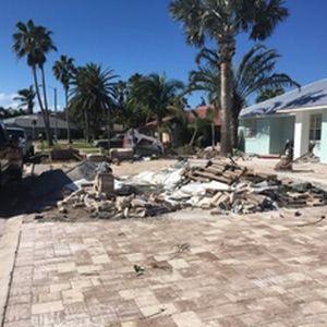 New paver driveway installed, removal of debri to prep for new palms