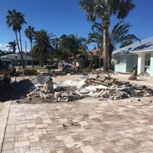 New paver driveway installed, removal of debri to prep for new palms